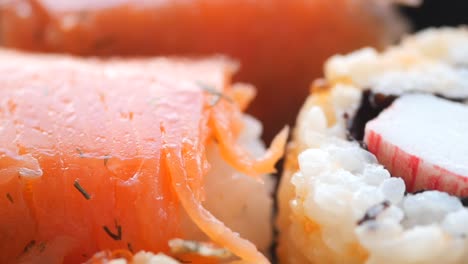 close up of sushi rolls with salmon