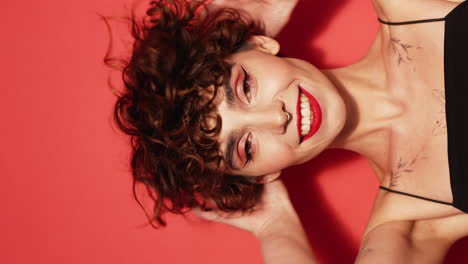 young beautiful smiling woman in studio