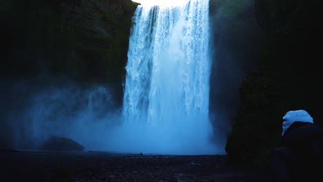 incredible slow motion video of man walking towards this fascinating waterfall