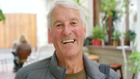 retired senior man happily laughing after enjoying