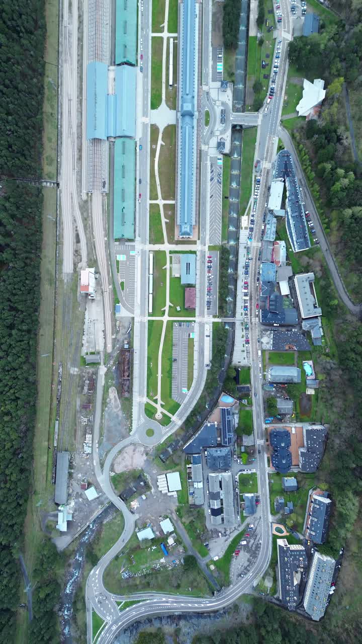 Large aerial view of Canfranc-Estación, Spain, showcasing the intricate rail yard and buildings