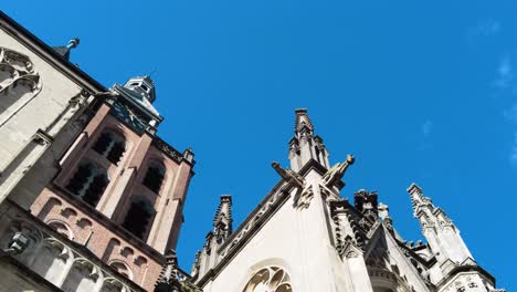 looking upwards to bell tower of gothic sint jans cathedral in the netherlands