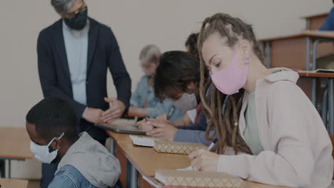 students in a classroom taking notes during a lecture