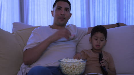 movie, father and boy on a couch