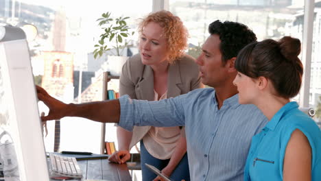 casual business team working together with computer
