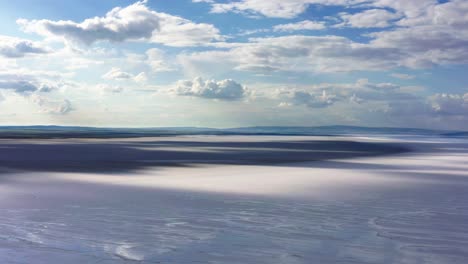 aerial view of salt lake with beautiful, cloudy, blue sky