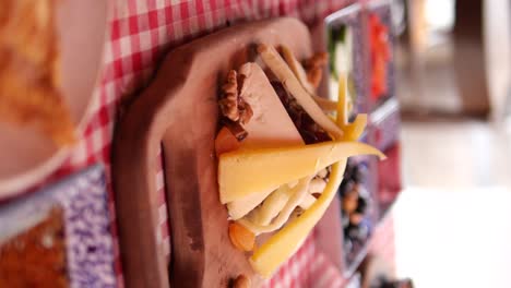 assorted cheese platter with fruits and nuts