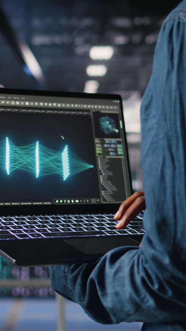 Vertical video Close up of admin using laptop to monitor neural network LLM visualization