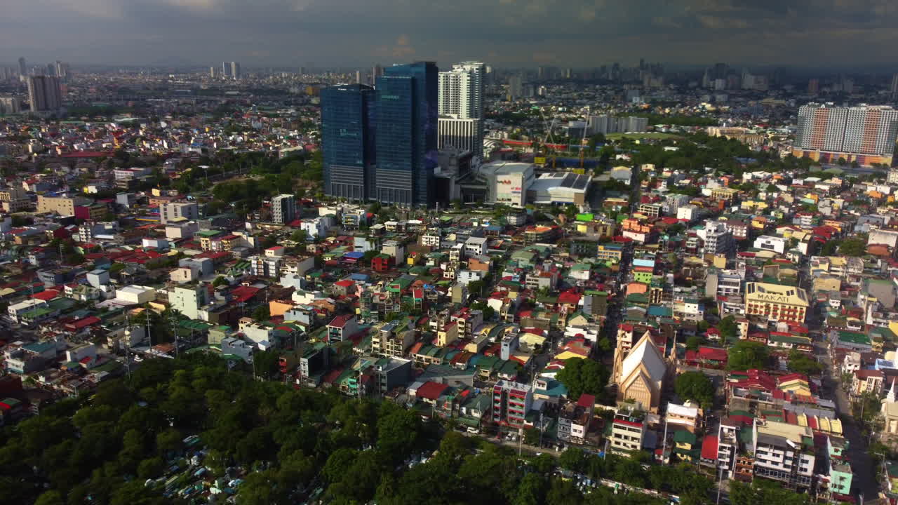 Aerial view toward the Ayala Malls Circuit, golden hour in Manila, Philippines