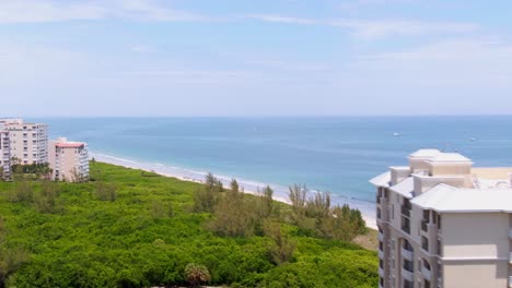orbiting drone shot of beautiful blue beach on florida east coast
