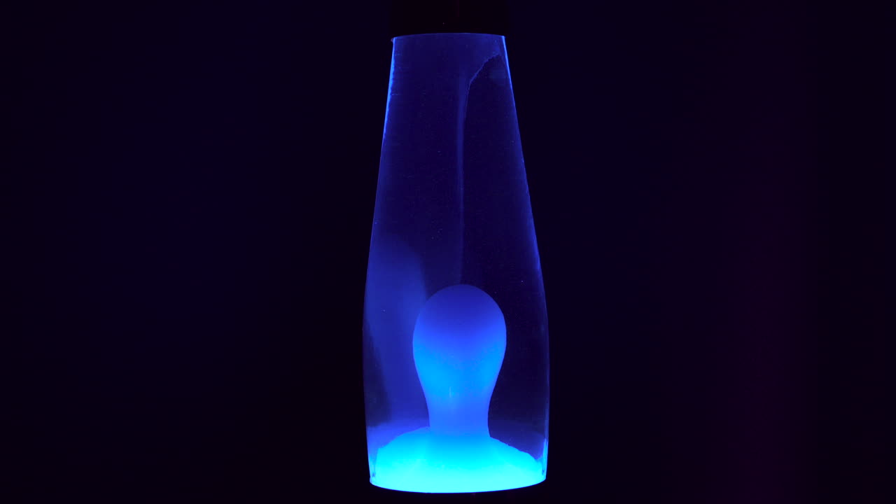 Blue lava lamp with a dark background