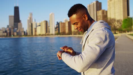 athletic african american male resting wearing smart watch