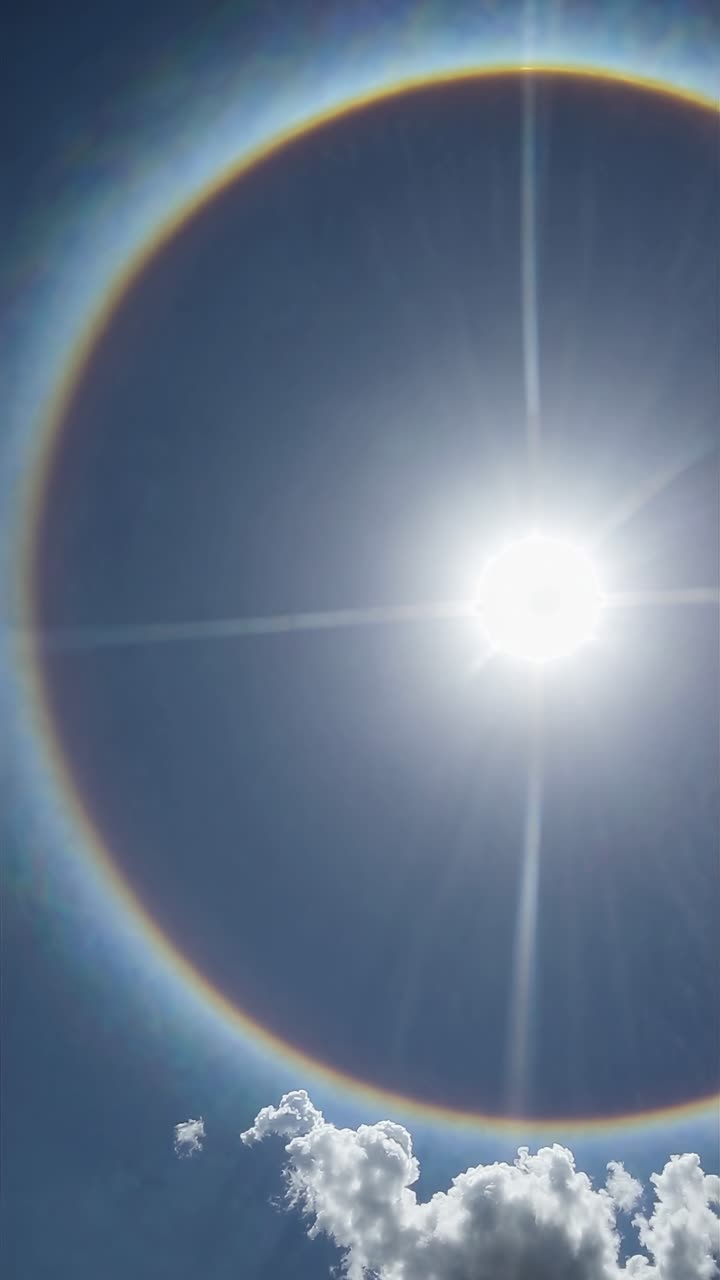 A stunning video still of a solar halo captured from a low-angle view, highlighting the sun's
