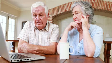 Senior-couple-using-laptop-together