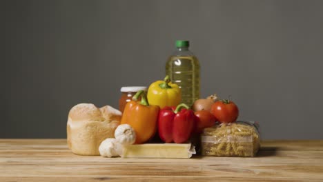 studio shot of basic food items on wooden surface and white background 2