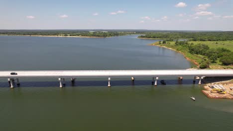 Aerial-footage-of-cars-driving-across-bridge