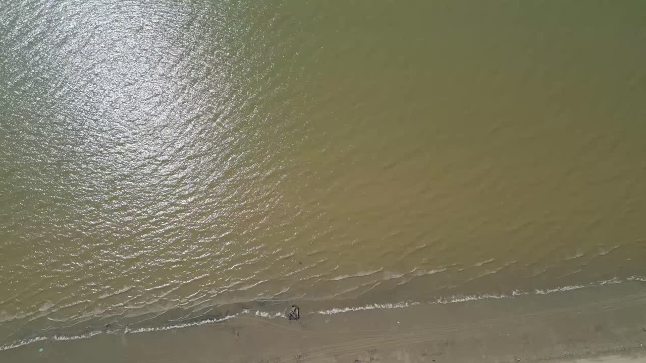 Aerial Drone View During Summer Alit Fishing Village,Kabong With, Facing Open Blue Sea, White Sandy Beach,Green Coconut, Palm Trees,And River,Sarawak,Borneo