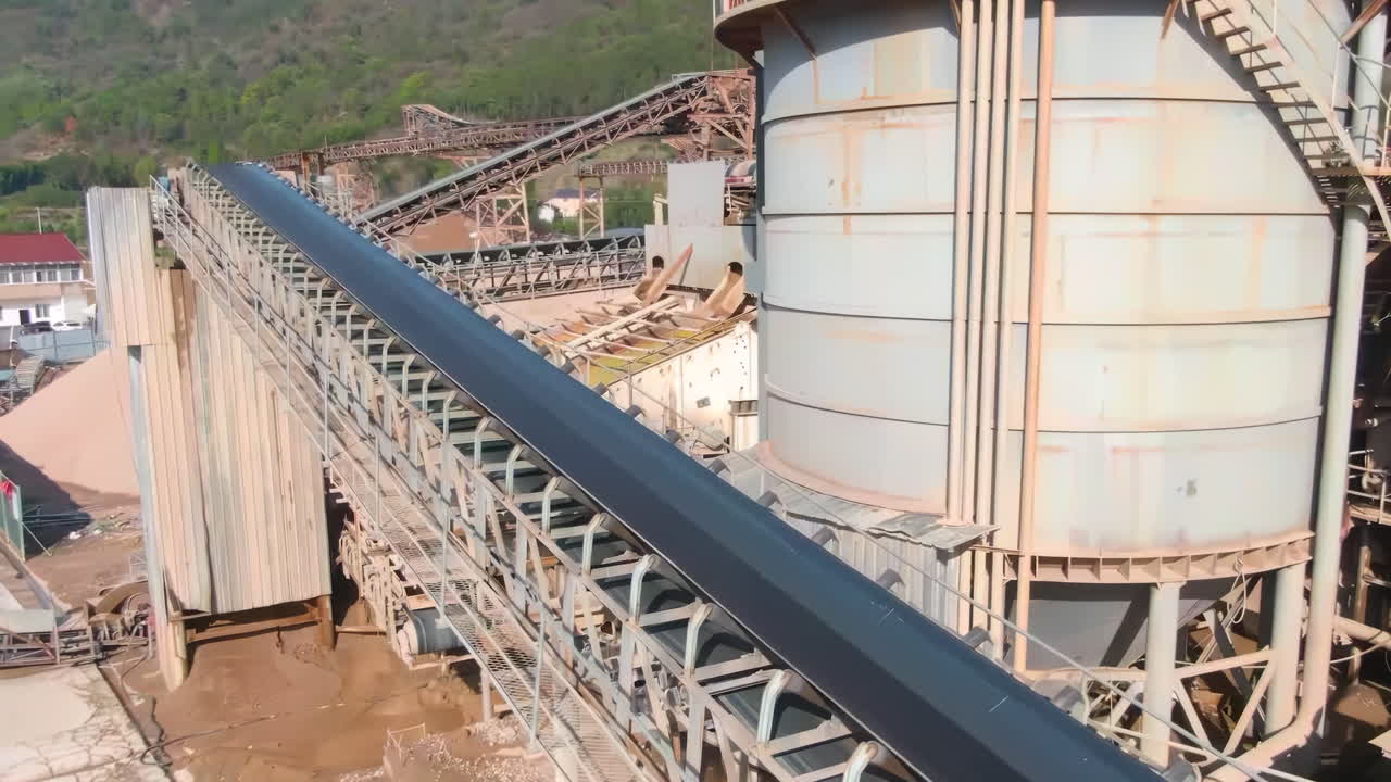 Sand quarry with industrial, sediment factory dock Sand quarry equipment mining sand from river banks destroying the natural environment