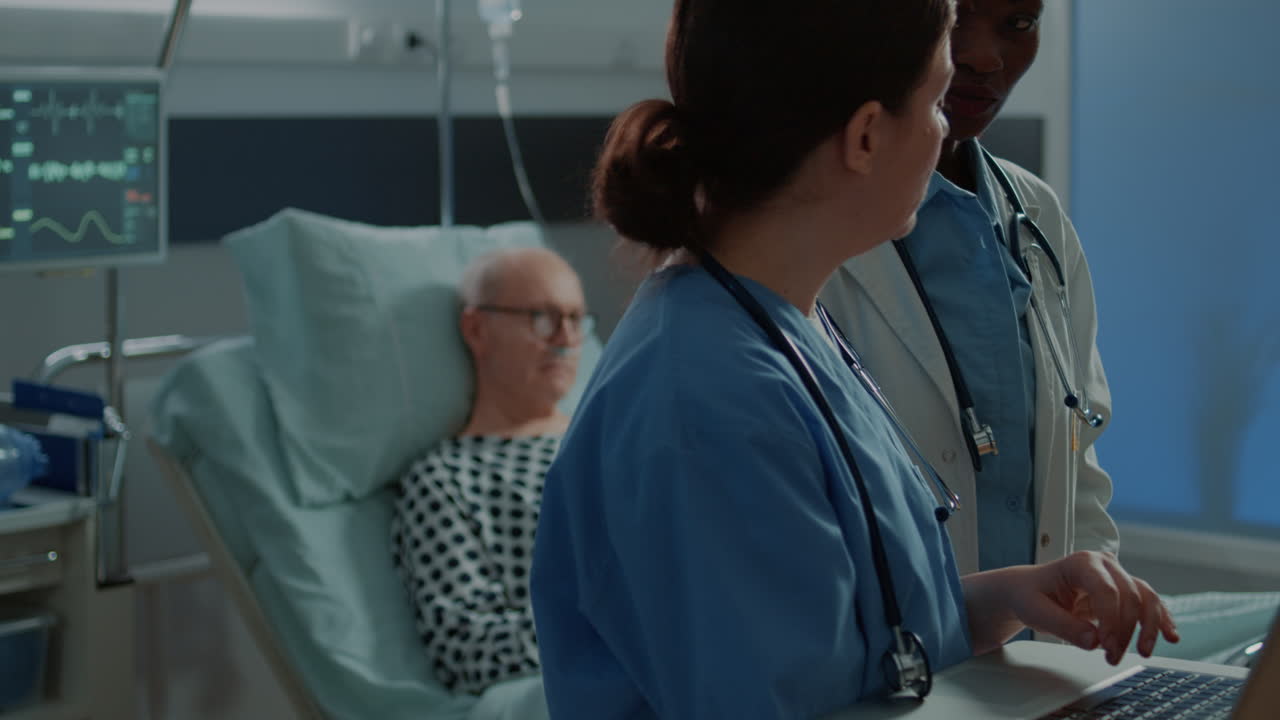 Multi ethnic hospital staff looking at medical tests