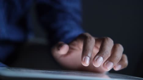 person using a tablet at night