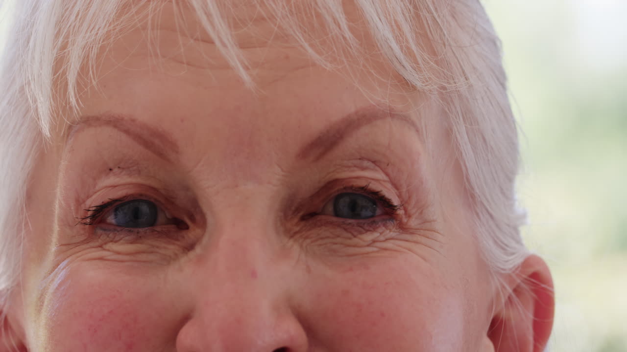Close-up of senior woman's eyes, expressing wisdom and experience at home