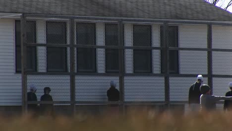 A-Group-Of-Amish-Children-Play-Together-Before-School-And-Then-Head-Inside