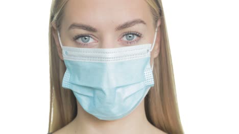 Close-up-portrait-of-a-blonde-woman-wearing-medical-PPE