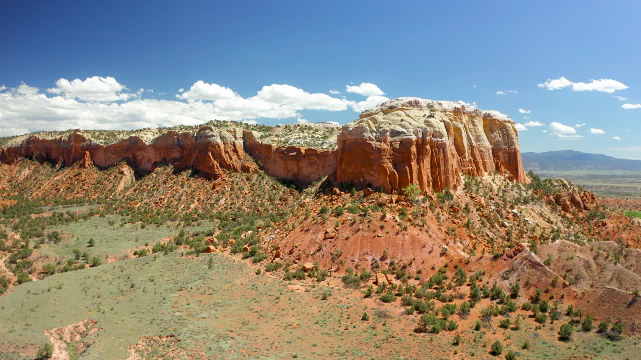 Flying across a canyon towards a rock formation at Ghost Ranch in Abiquiu New Mexico.