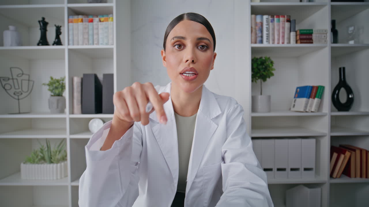 Physician prescribing therapy online in polyclinic office closeup pov video