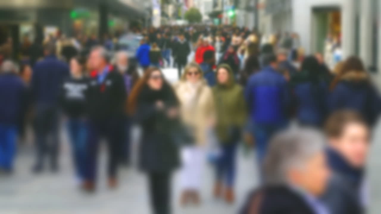 People on Calle del Carmen Street. Madrid, Spain. Out of focus. Time lapse. Calle del Carmen Street, near Puerta del Sol Square. Timelapse. Madrid, Spain