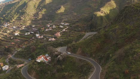 a car driving curves on the street in the mountains