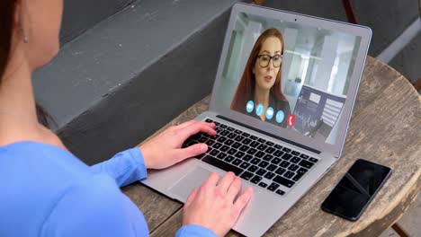 Woman-talking-on-video-meeting-on-her-laptop