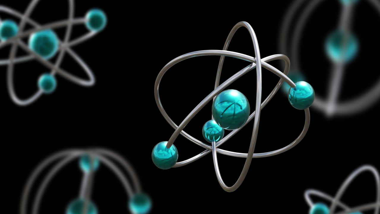 Animation of atom models spinning on black background