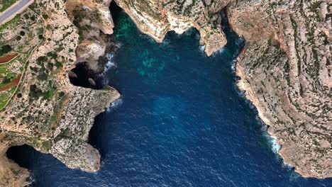 aerial top down drone view of blue grotto and malta coastline