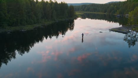 fly fisherman fishing in a river