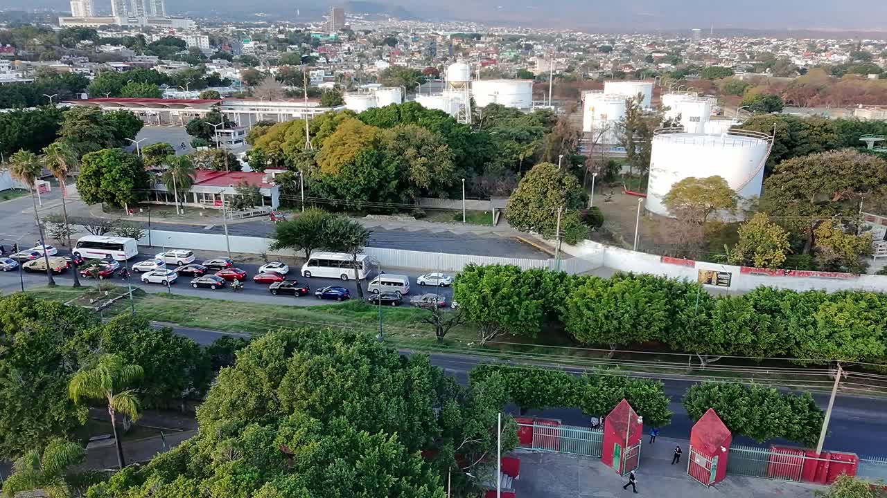 Pan drone shot of Jiutepec busy street and cityscape during the day in Morelos, Mexico
