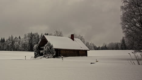 time-lapse-of-a-beautiful-winter-landscape-with-a-chalet-in-the-meadow-covered-with-a-blanket-of-snow