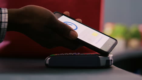 customer using phone nfc payment
