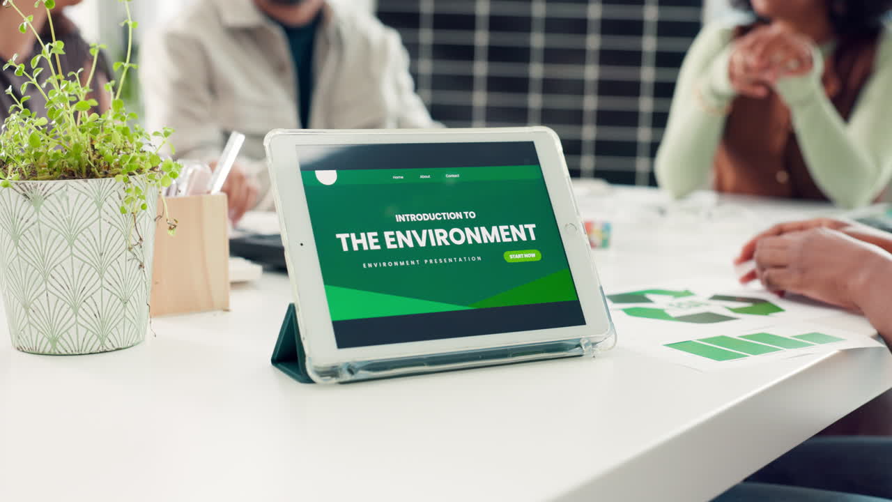 Tablet Displaying Environmental Presentation in an Office Meeting