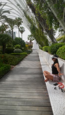 woman relaxing in a park with vr headset