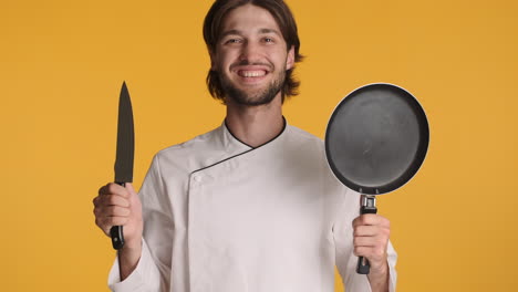 caucasian man in front of camera on yellow background.