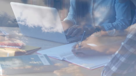 animation of people working using laptop and writing over clouds in background