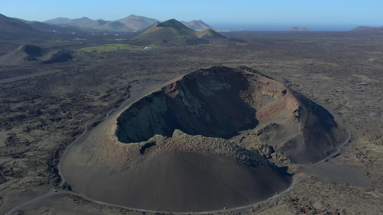 Aerial drone view of mountain sea and volcanoes in Lanzarote, Canary Islands, Spain