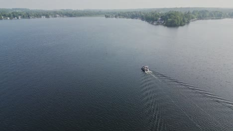 Aerial-View-Of-A-Ferry-Boat-Cruising-On-Tranquil-Sea