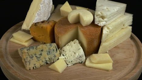 cheese platter: sharp, subtle, hard, soft cheeses rotate on wood board