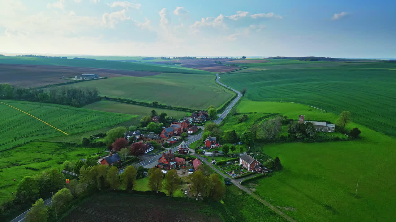 Drone captures Burwell village, formerly medieval market town&mdash;countryside fields, aged red brick homes, and the obsolete Saint Michael parish church atop Lincolnshire's Wold Hills