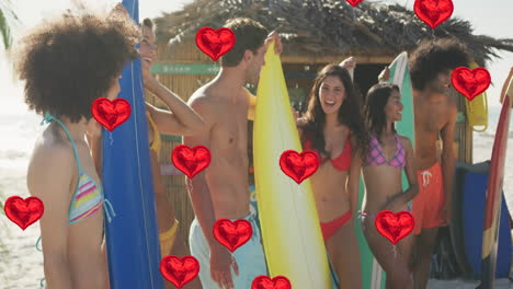 animation of heart digital icons over friends with surfboards on beach