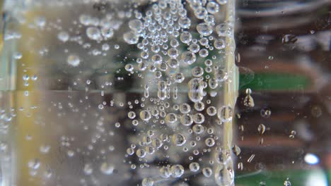 close-up of effervescent bubbles in a clear liquid