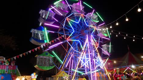 lampang,thailand - january 19, 2020 ferris wheel players who make happy at night market in ko kha, lampang,thailand local people tourists enjoy.