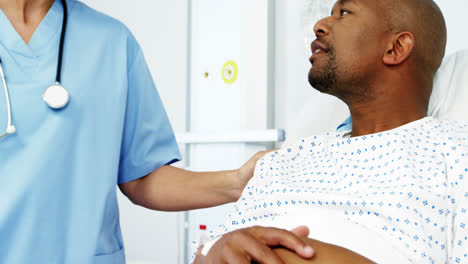 Female-doctor-interacting-with-patient